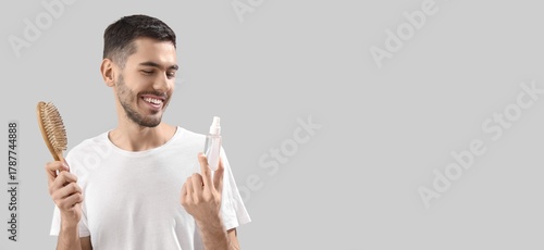 Happy young man with brush ...