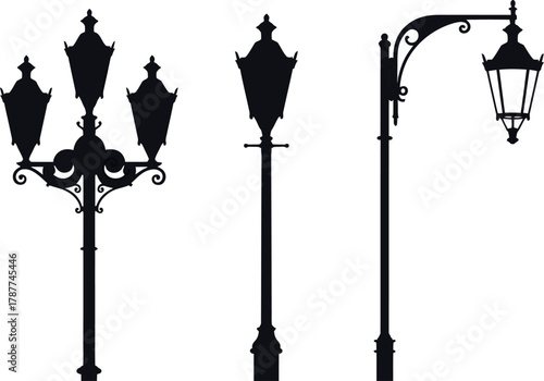 Antique metal lamppost architecture in the old city providing electric street light on a white background