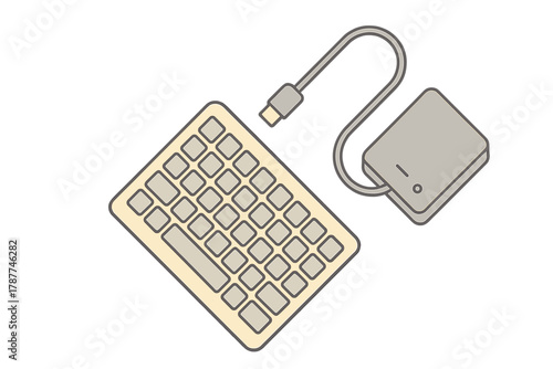 Compact computer keyboard linked to external data storage unit by cable