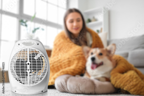 Young woman and Corgi dog w...