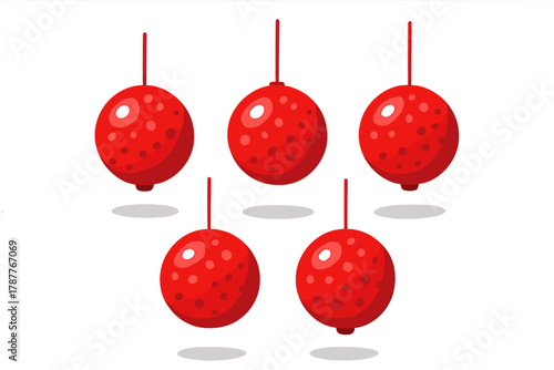 Five hanging red Christmas ornaments decorated with white polka dots