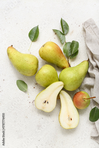 Ripe pears on white table