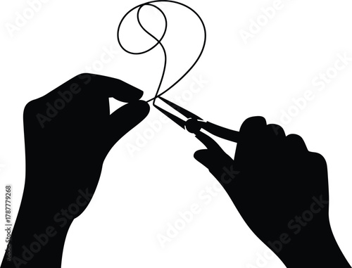 jewelry maker hand shaping metal wire