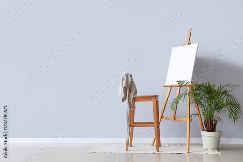 Wooden easel with blank can...