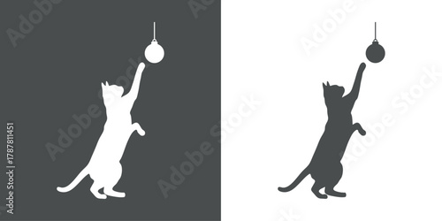 Silueta de gato jugando con una bola de navidad con hilo colgante 