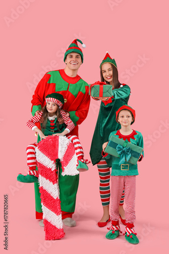 Happy family in elf's costu...