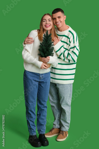 Happy young couple embracin...