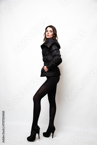 Young impressive model posing in pantyhose and bra