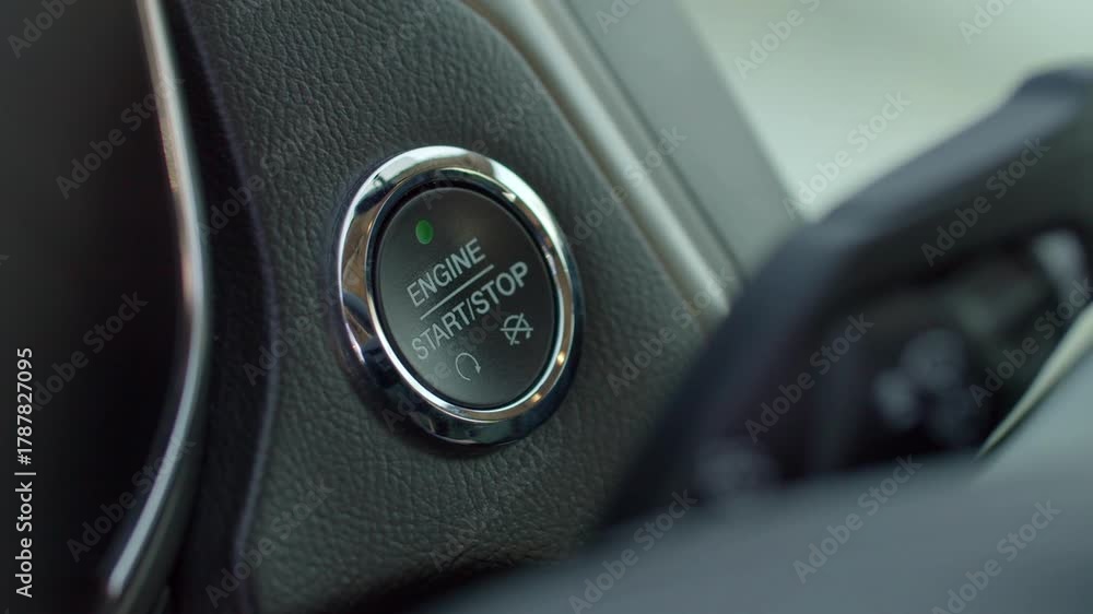 Engine starting and stopping system. closeup Pressing button to start ...