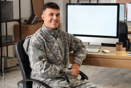 Young male soldier sitting ...