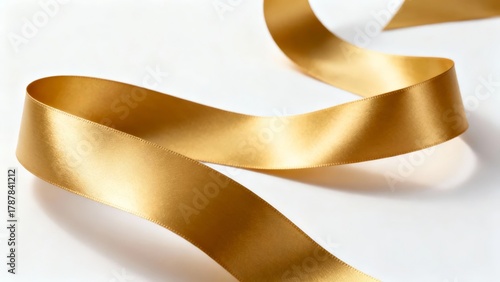 A close-up of a golden satin ribbon with smooth curves and reflective texture, set against a clean white background.