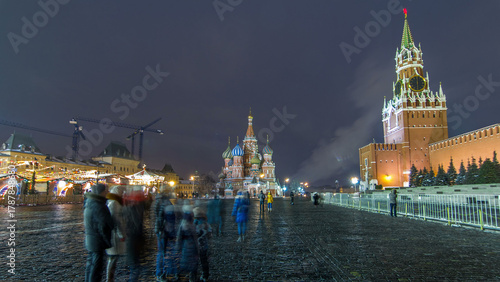 Red Square in winter day to night timelapse. Moscow Kremlin with Spasskaya tower and Cathedral of St. Basil, Russia