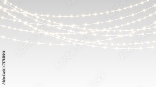 Garland decorated with festive lights ribbons and glowing bulbs on christmas holiday stage.
