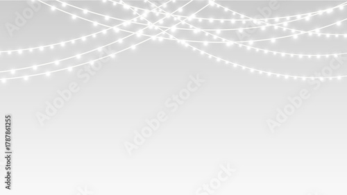 Garland glowing softly with fairy lights for festive Christmas party decoration and banner.
