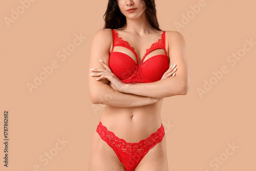 Pretty young woman in red u...
