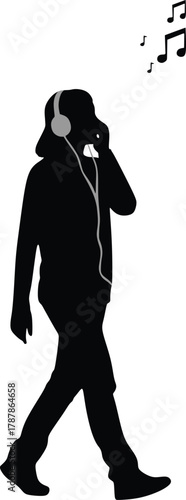 Silhouette of a person listening to music while walking
