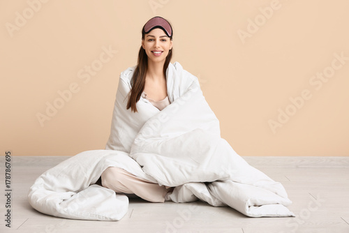 Young woman in pajamas and ...