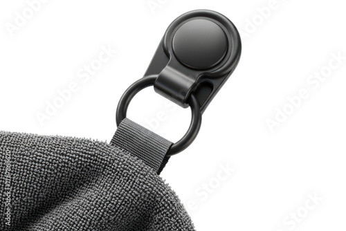 Black metal snap hook on a hanging loop of a gray sport towel on a transparent background