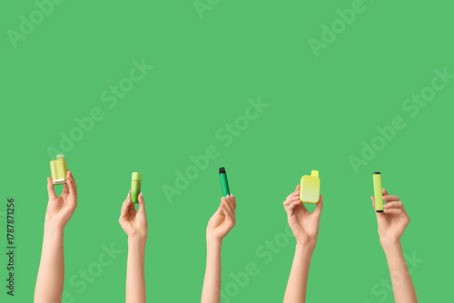 Many hands holding electron...