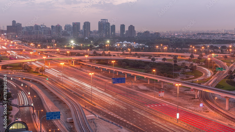 Obraz premium Aerial top view to Sheikh Zayed road near Dubai Marina and JLT night to day timelapse, Dubai.