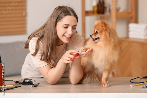 Female groomer trimming cut...