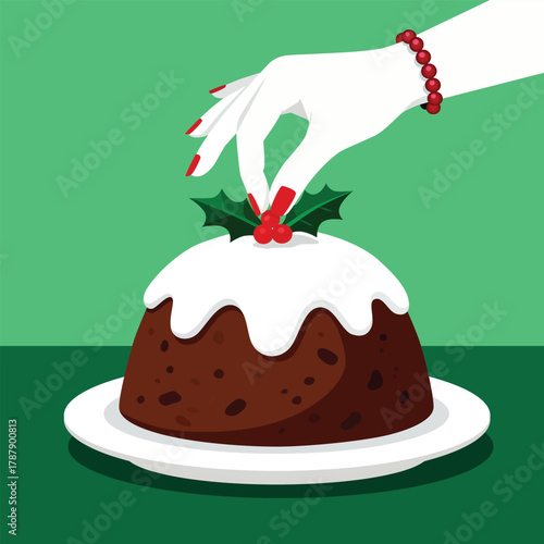 Elegant hand decorates festive Christmas pudding