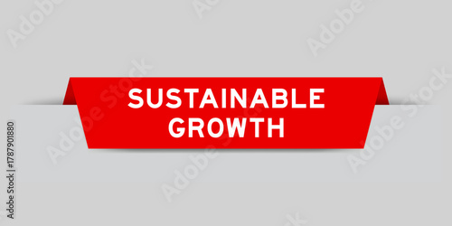 Red color inserted label with word sustainable growth on gray background