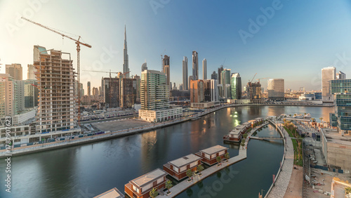 Photography Skyscrapers near canal in Dubai with blue sky aerial timelapse