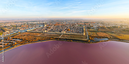 Aerial view of the medieval city of Aigues-Mortes at sunrise, in the Gard department, Occitanie region, France