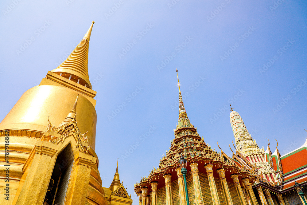 Fototapeta premium Wat Phra Kaew or Wat Phra Sri Rattana Satsadaram is temple used for various royal ceremonies during reign of King Rama I. It is temple within the Grand Palace. Inside temple is the Emerald Buddha.