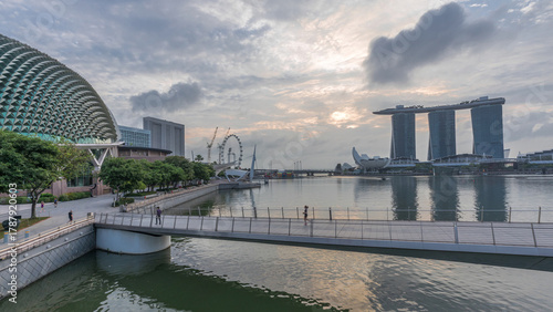 Photography Skyline in Marina Bay with Esplanade Theaters on the Bay and Esplanade footbridge night to day timelapse in Singapore