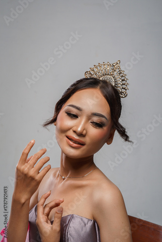 Beauty portrait of Asian woman in silver gown