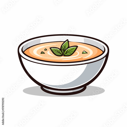 Creamy soup in a white bowl with green basil garnish healthy food concept