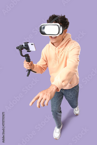 Male blogger in VR glasses ...