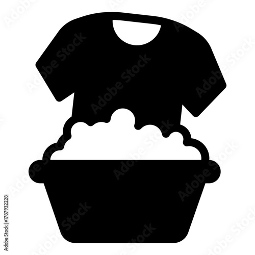 Shirt in washing basin with soap foam solid icon, body hygiene concept. Vector graphics. Basin with foam powder, laundry sign on white background, style icon mobile or web design.