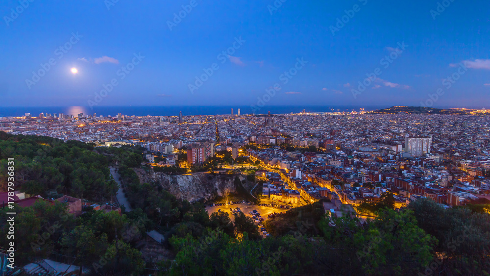 Obraz premium View of Barcelona day to night timelapse, the Mediterranean sea, The tower Agbar and The twin towers from Bunkers Carmel. Catalonia, Spain.