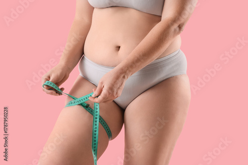 Overweight woman in underwe...