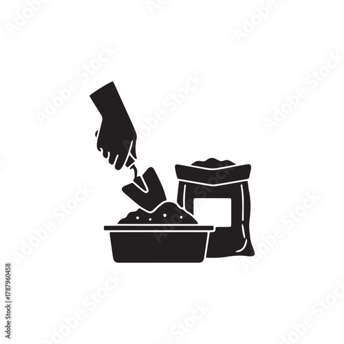 Gardening essentials Hand filling a container with soil from bag