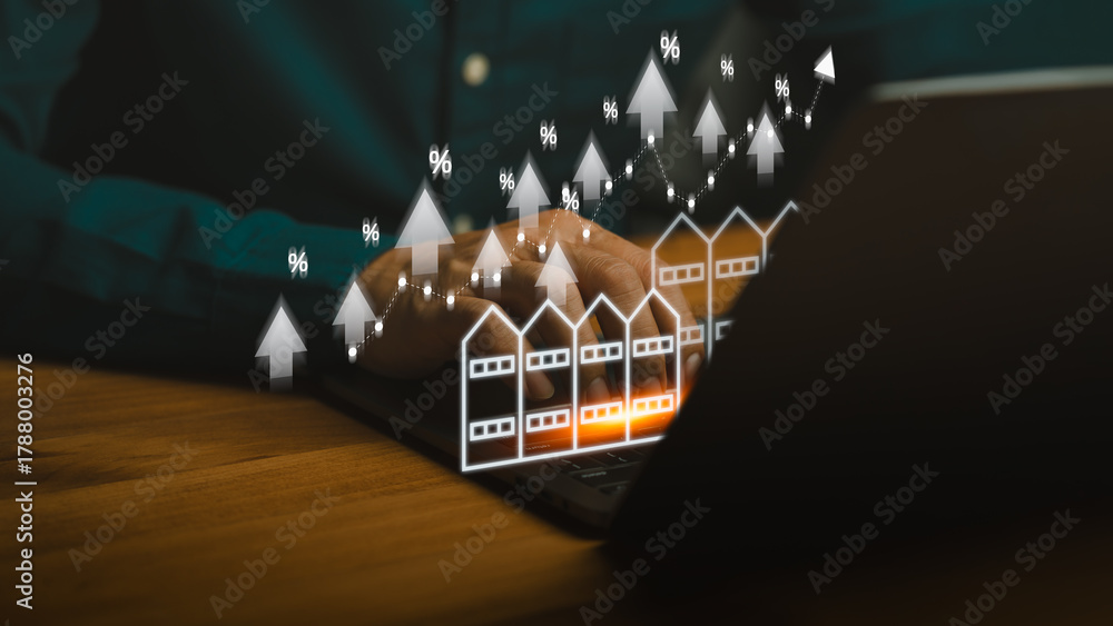 Fototapeta premium Real estate market growth concept showing person using laptop with rising commercial building icons, percentage symbols, and upward arrows, representing property investment, shophouse, housing trends.