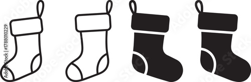 Four black and white Christmas stockings with a white background.