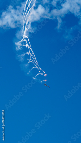Sukoi attack aircraft in an Air Show in Guwahati Assam releasing flares 2 vertical photo