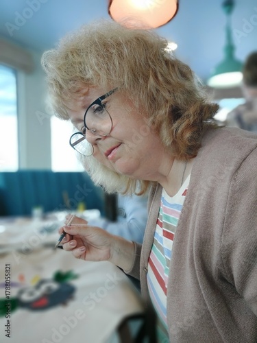 a portrait of a thoughtful woman wearing glasses,profile view.