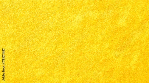 Close up view of a bright yellow textured surface ideal for backgrounds showcasing its rough fibrous and uneven matte appearance in vibrant detail