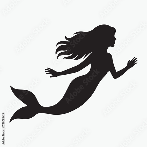 Black silhouette of a mermaid swimming underwater with her tail