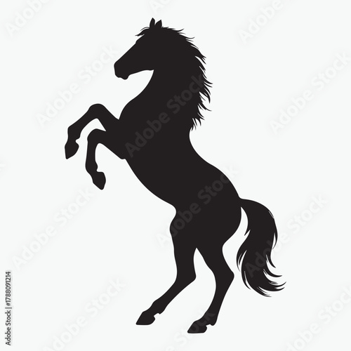 Dynamic silhouette of a powerful rearing horse in motion