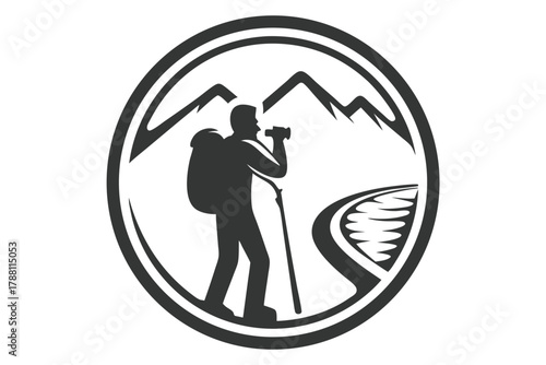 Silhouette of a male hiker with binoculars and backpack on mountain trail in circle