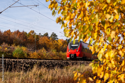 Passengers train traveling through  an autumn scenery in Nuremberg