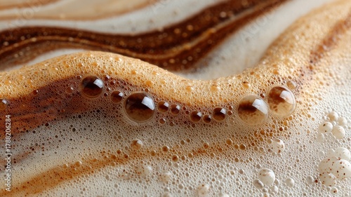 macro coffee foam background, micro-bubbles, crema swirls in caramel and mocha, luminous highlights