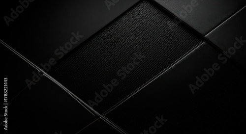 Sleek modern black abstract background with carbon fiber texture and polished leather accents, conveying luxury and sophistication for premium design projects.