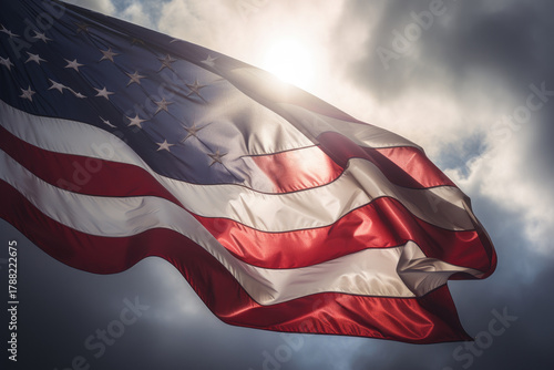 USA flag background. Waving American flag in sunlight flare, close up